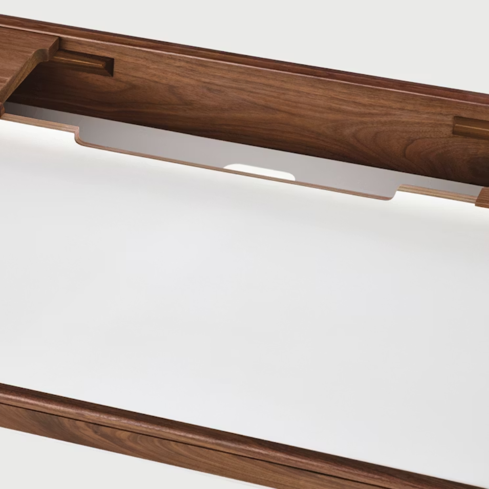 The Airia Desk from Herman Miller with the storage compartment open.