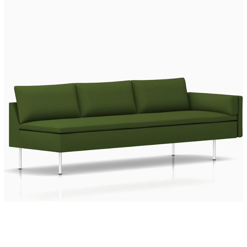 The Bolster Three Seat Sofa from Herman Miller with left arm in dark olive green hopsak upholstery.