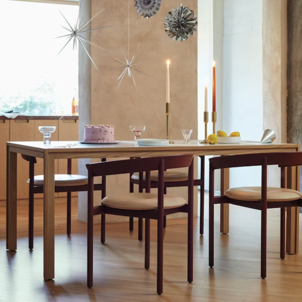 The oak Doubleframe Table from Herman Miller in a kitchen and dining space.