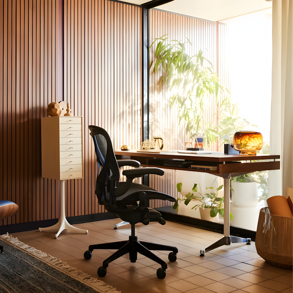 The walnut Eames 2500 Series Executive Desk from Herman Miller in a business space.
