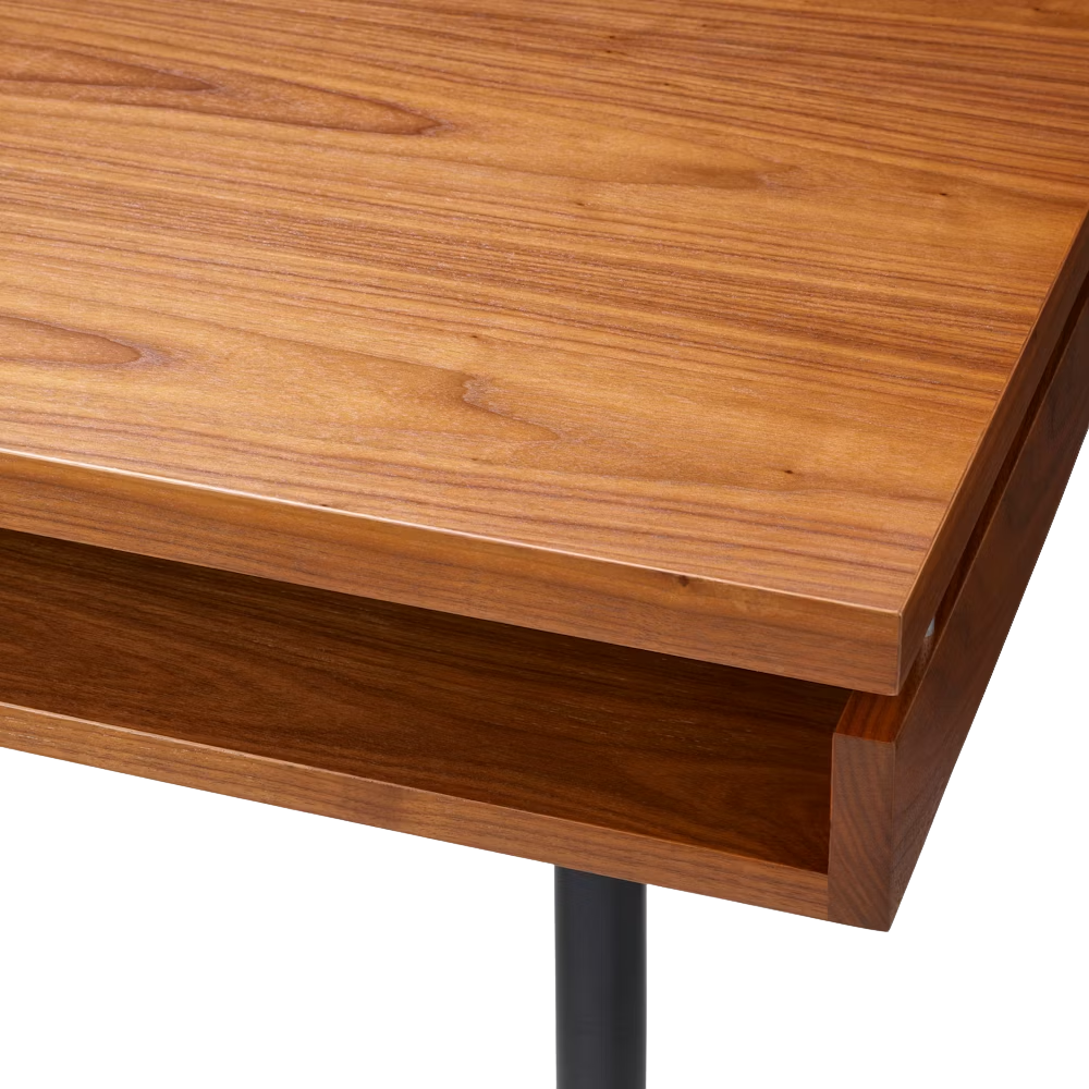 The walnut Eames 2500 Series Executive Desk from Herman Miller close up.