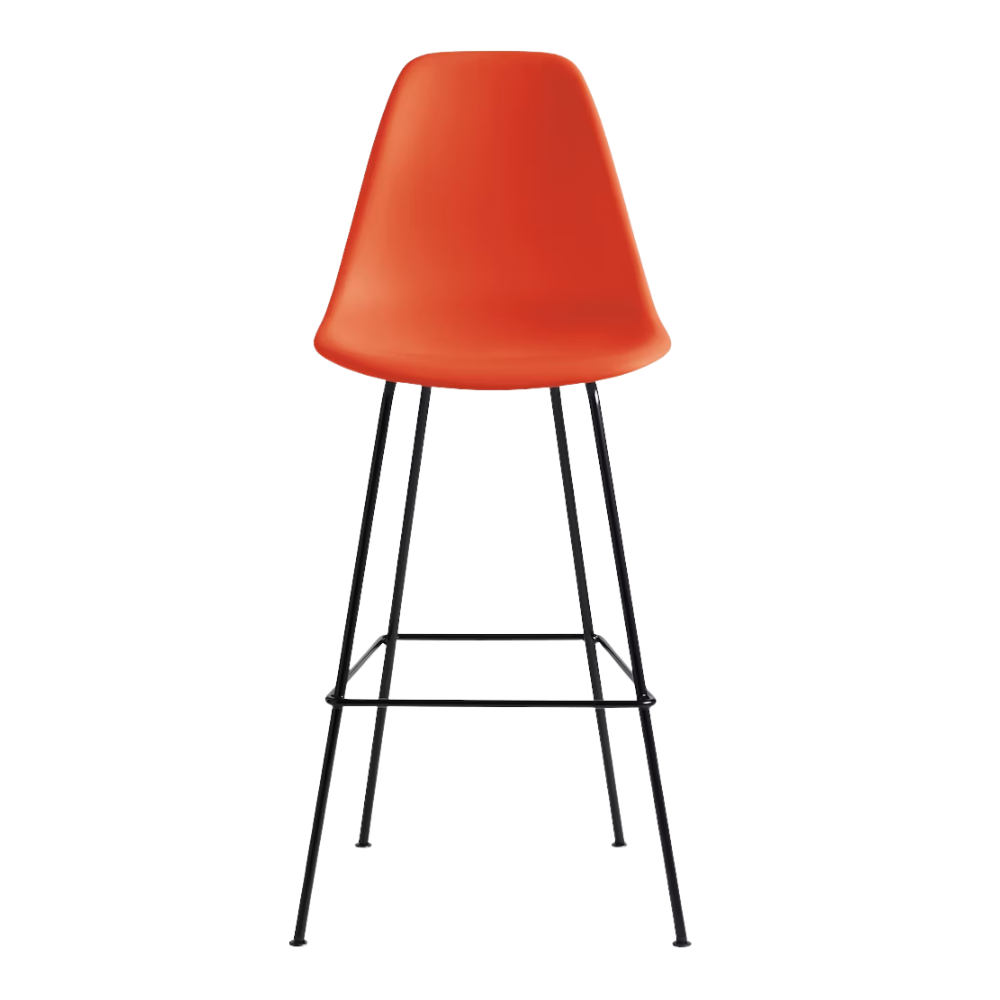 The red orange shell Eames Molded Plastic Bar Height Stool from Herman Miller with the black base.
