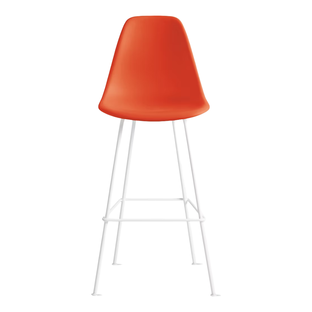 The red orange shell Eames Molded Plastic Bar Height Stool from Herman Miller with the white base.