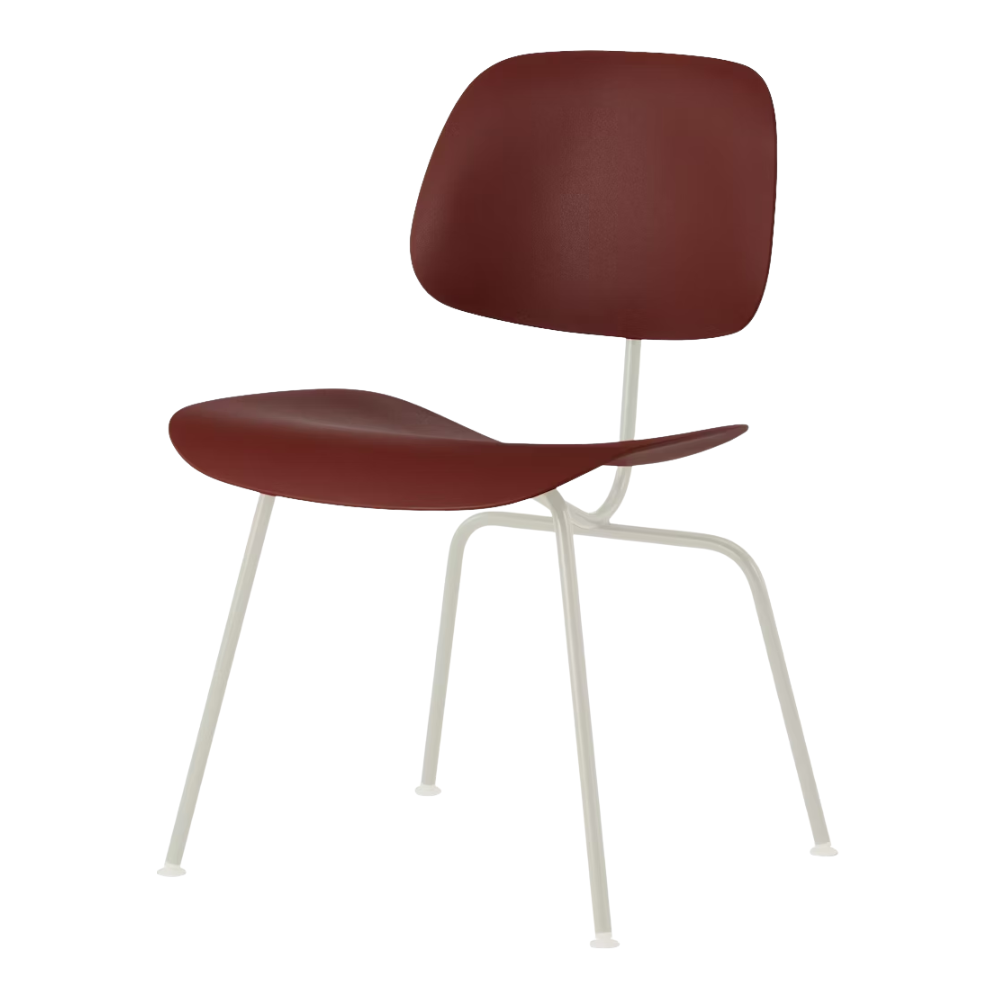 The Eames Molded Plastic Dining Chair from Herman Miller with the brick red shell and white leg finish.