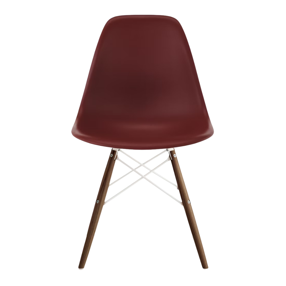 The brick red shell Eames Molded Plastic Side Chair Dowel-Leg Base from Herman Miller with the white base and walnut legs.