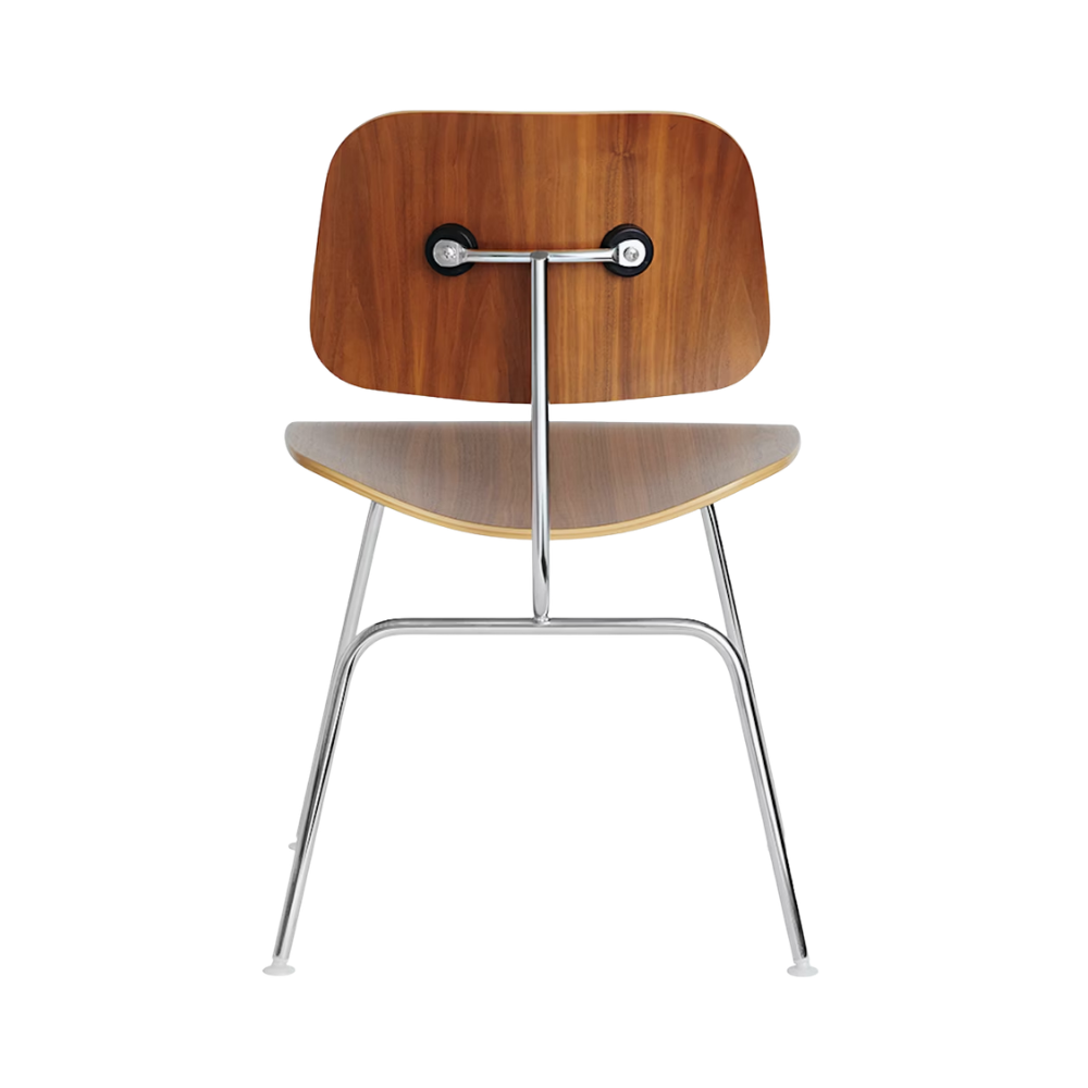 The back of the Eames Molded Plywood Dining Chair Metal Base from Herman Miller with the walnut shell and trivalent chrome legs.