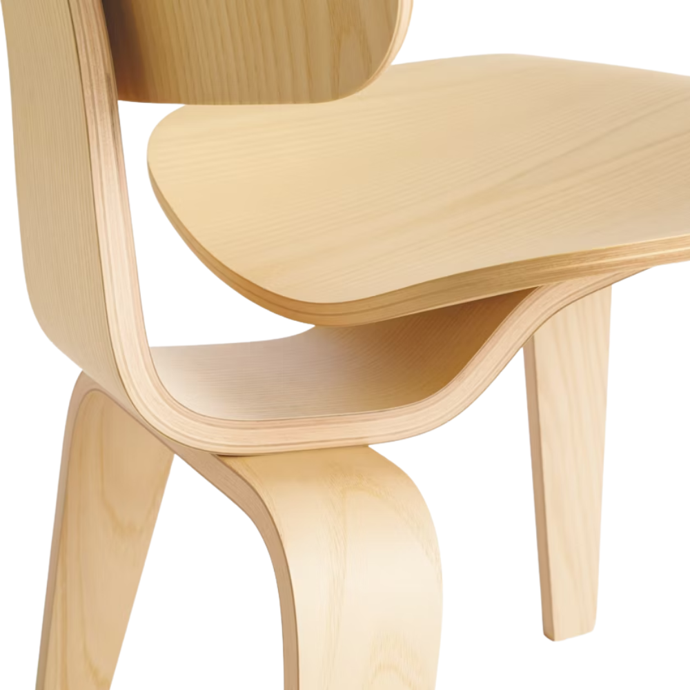 The white ash Eames Molded Plywood Dining Chair Wood Base from Herman Miller close up.