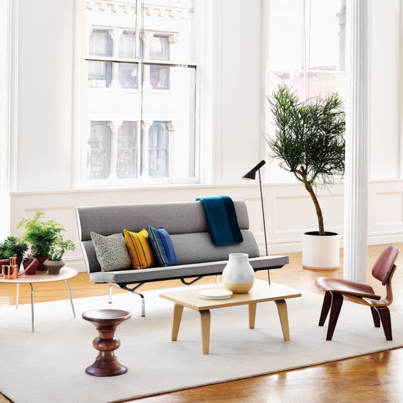 The studio white and ash laminate Eames Rectangular Coffee Table in a family area.