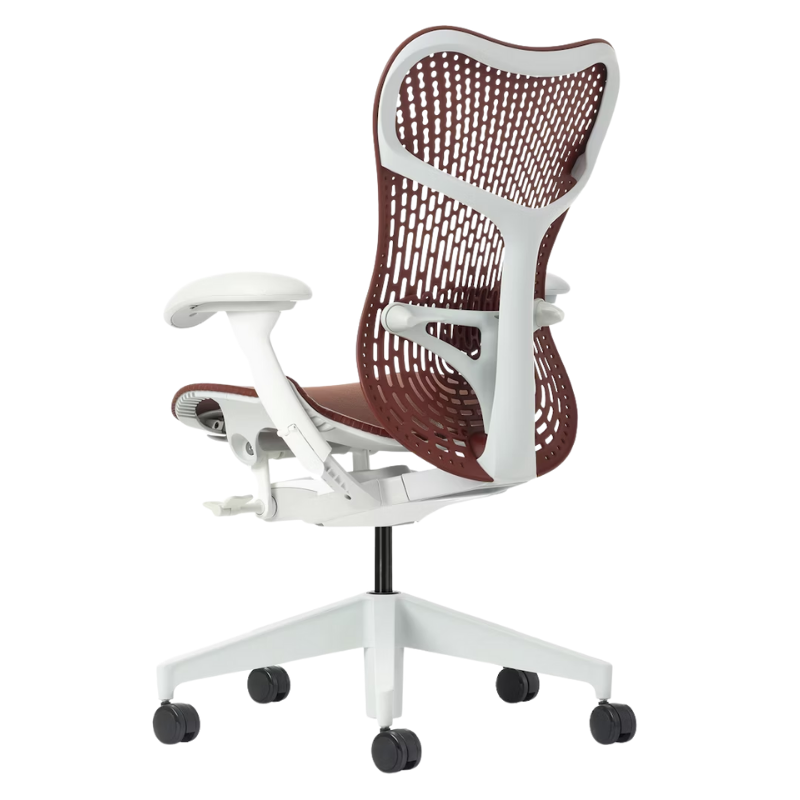 The Mirra 2 Chair from Herman Miller with the triflex polymer back and alpine frame in corodvan color from the back at an angle.