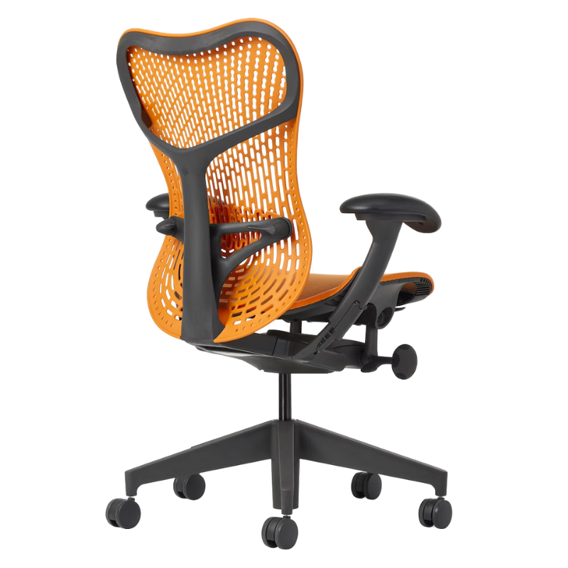 The Mirra 2 Chair from Herman Miller with the triflex polymer back and graphite frame in ochre color from the back at an angle.