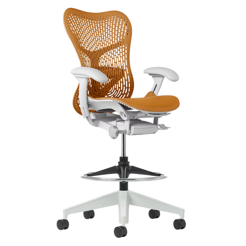 The Mirra 2 Stool from Herman Miller with the Triflex Polymer Back, alpine frame and ochre color.