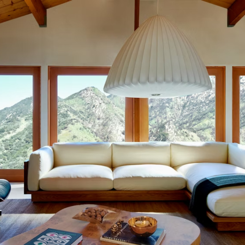 The Nelson Bell Bubble Pendant from Herman Miller in a modern living room.