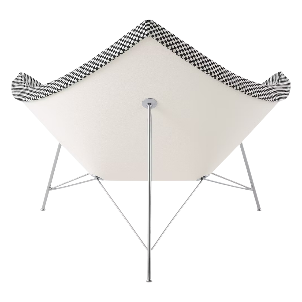 The Nelson Coconut Chair from Herman Miller with the black and white checker upholstery and chrome base from the back.