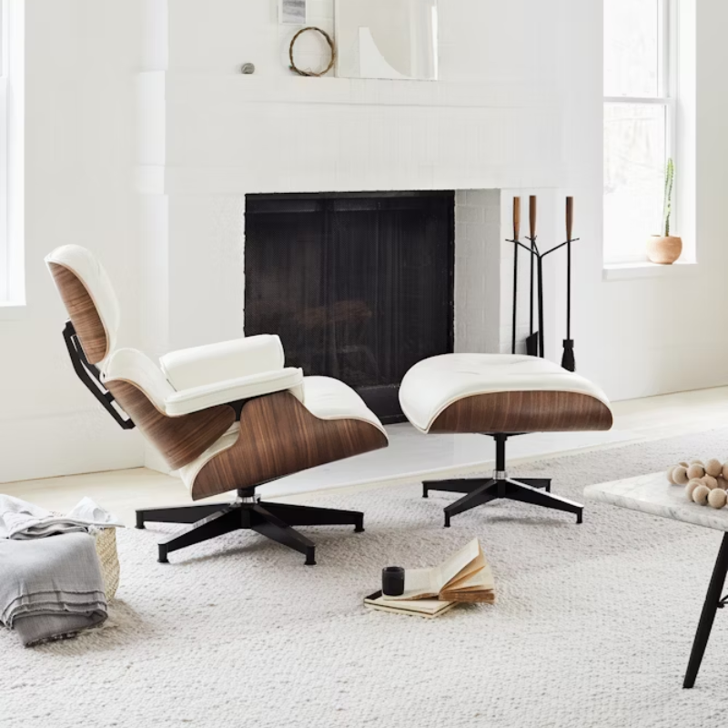 The Nelson Fireplace Tool Set from Herman Miller in a den.