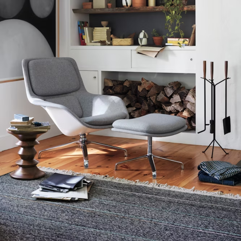 The Nelson Fireplace Tool Set from Herman Miller in a family space.