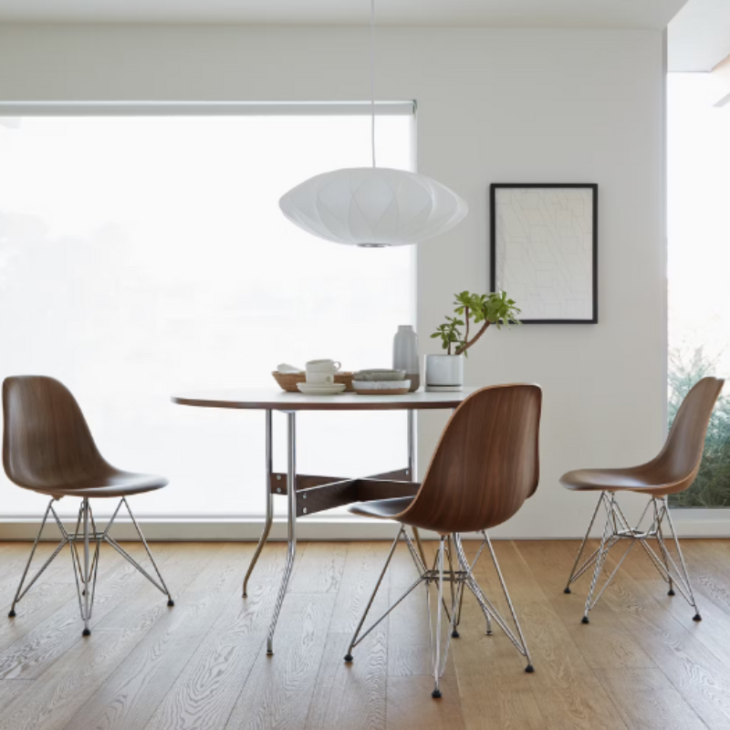 The Nelson Saucer Crisscross Bubble Pendant from Herman Miller in a living room.