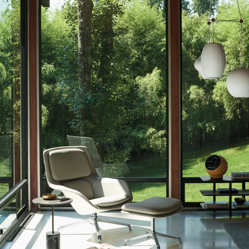 The Nelson Triple Bubble Pendant Fixture from Herman Miller in a lifestyle photograph in a living room.