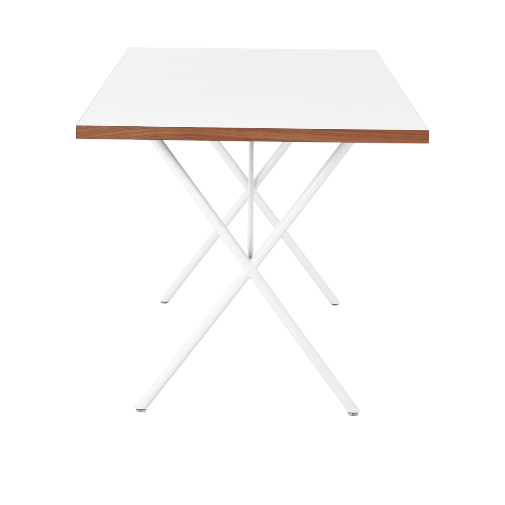 The 30 by 60 inch white Nelson X-Leg Table from Herman Miller from the side.