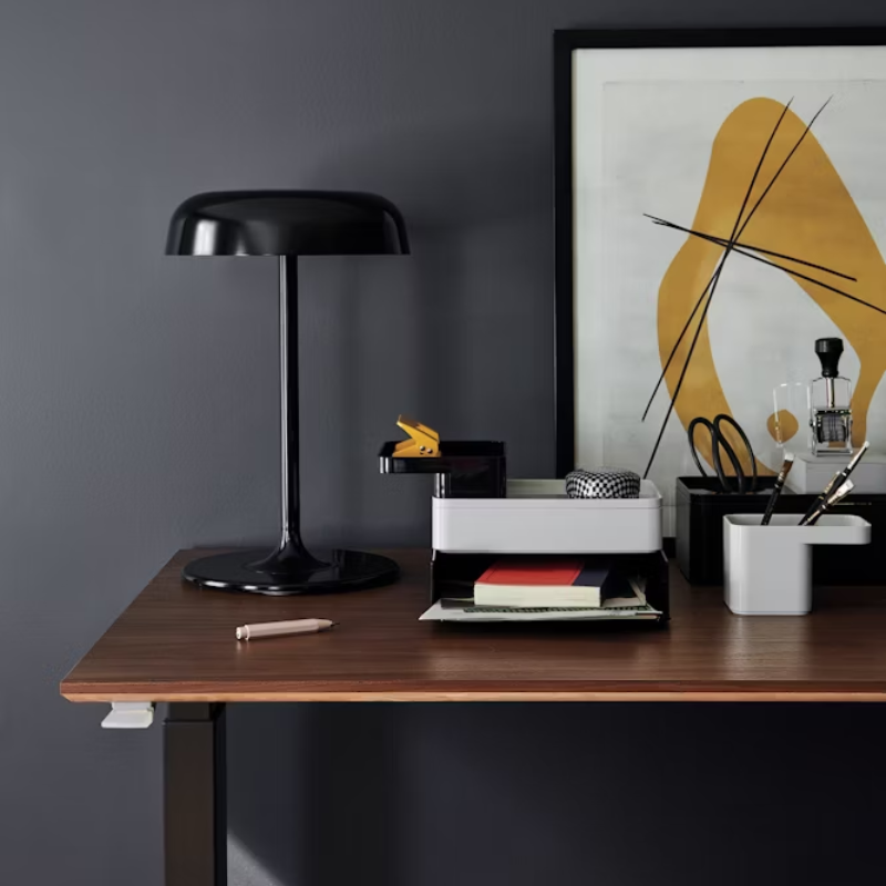 The Ode Desk Lamp from Herman Miller on a desktop.