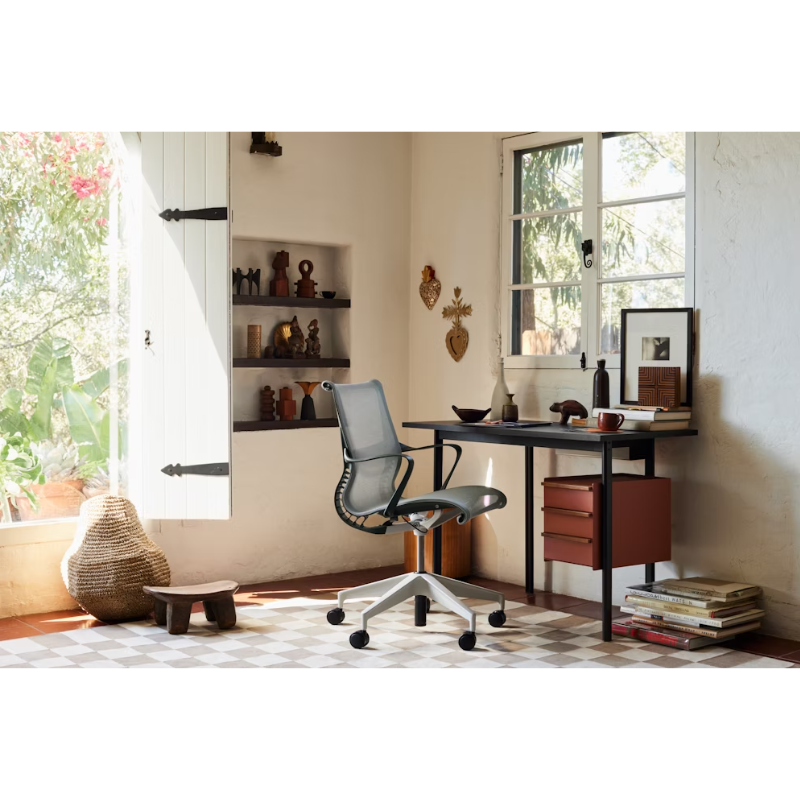 Setu Office Chair with Ribbon Arms by Herman Miller in Graphite intercept upholstery with graphite frame and silver alloy base in a home office.