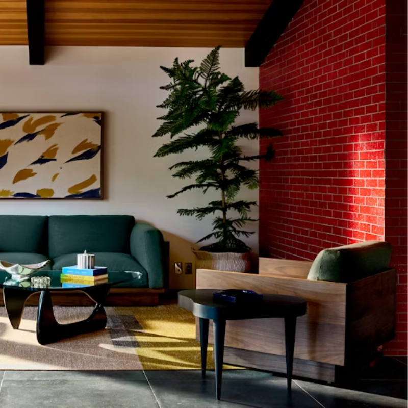 The Tudor Walnut Pawson Drift Lounge Chair from Herman Miller with beck woodlet upholstery in a family area. all-groups