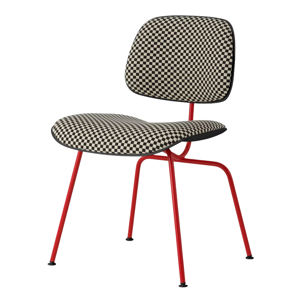 The Upholstered Eames Molded Plastic Dining Chair from Herman Miller with black and white checker upholstery, black shell and blaze leg finish.