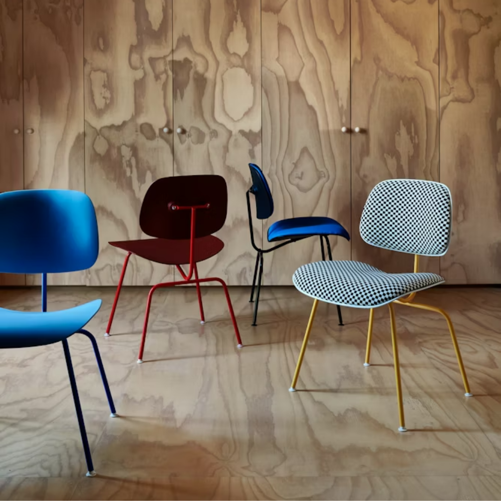 The Upholstered Eames Molded Plastic Dining Chair from Herman Miller options in a living room. all-groups