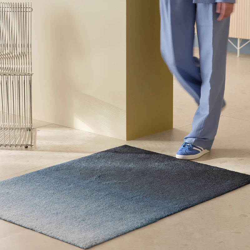 The Dis Doormat from Heymat in fjord in a bedroom.
