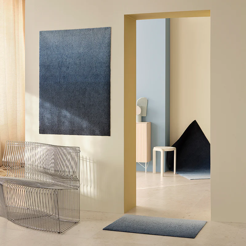 The Dis Doormat from Heymat in fjord in an entryway.