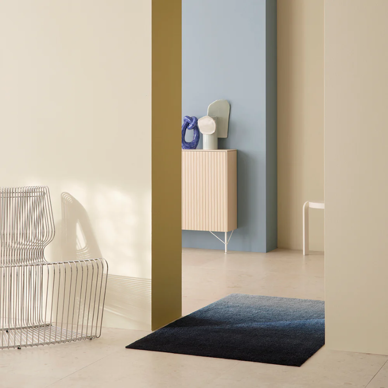 The Dis Doormat from Heymat in fjord in a lounge.