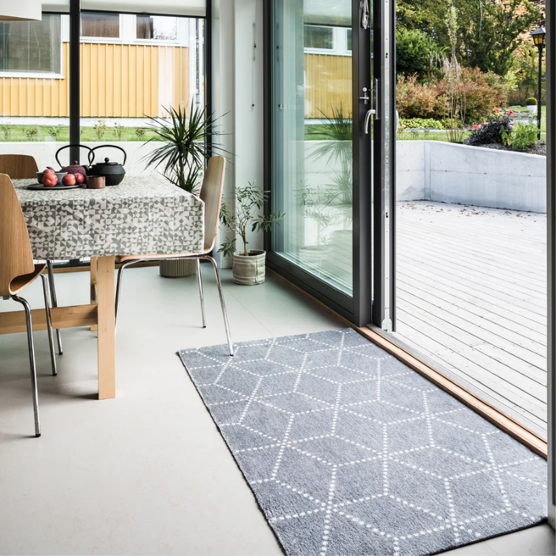 The Hagl Doormat from Heymat in silver in an entryway.