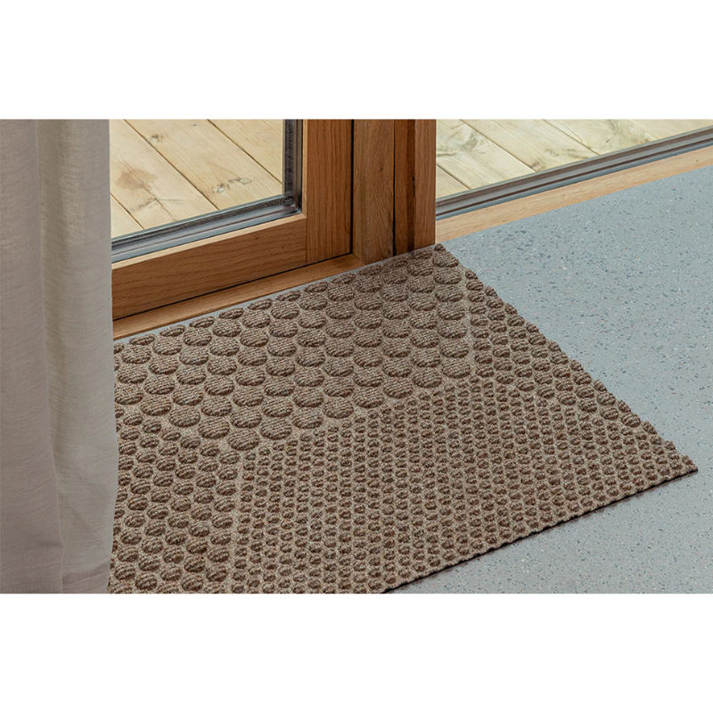 The Hex Doormat by Heymat in a doorway.