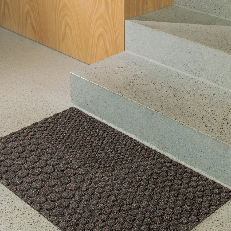 The Hex Doormat by Heymat in a family space.