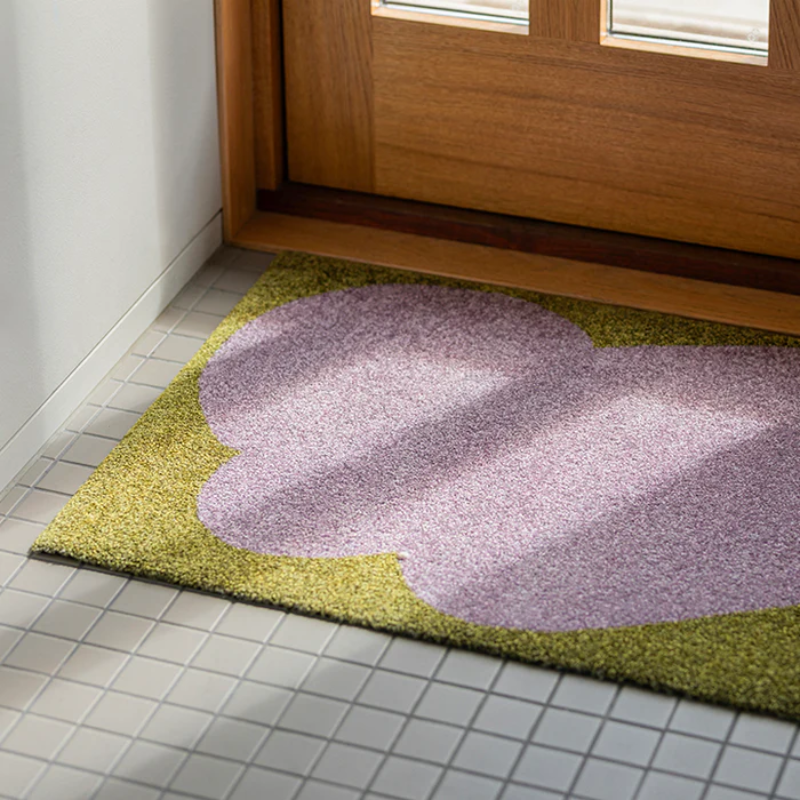 The Heymat x Sight Doormat from Heymat in unseen lilac in a doorway.