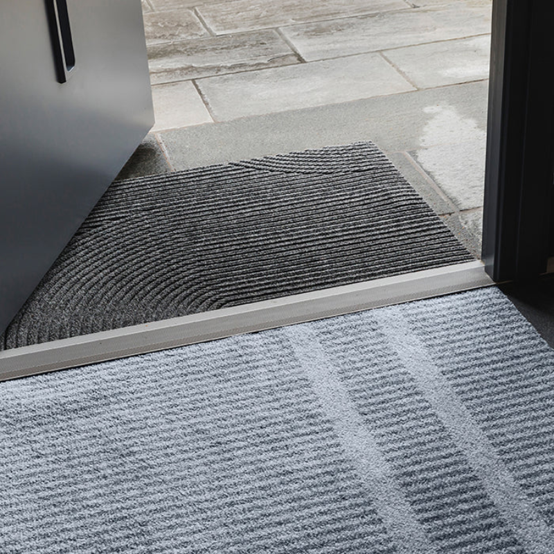 Small Løype indoor doormat by Haymat in entryway