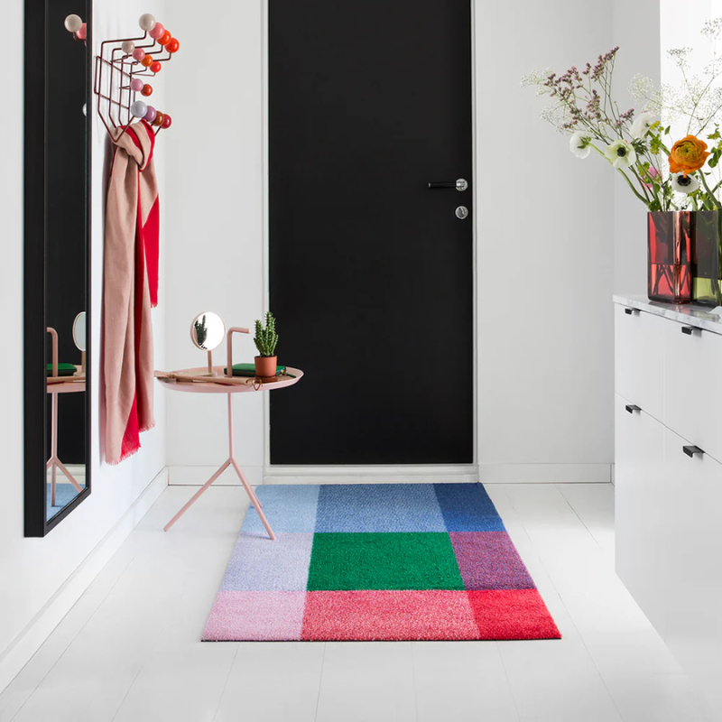 The Mix Doormat from Heymat in forest in a doorway.