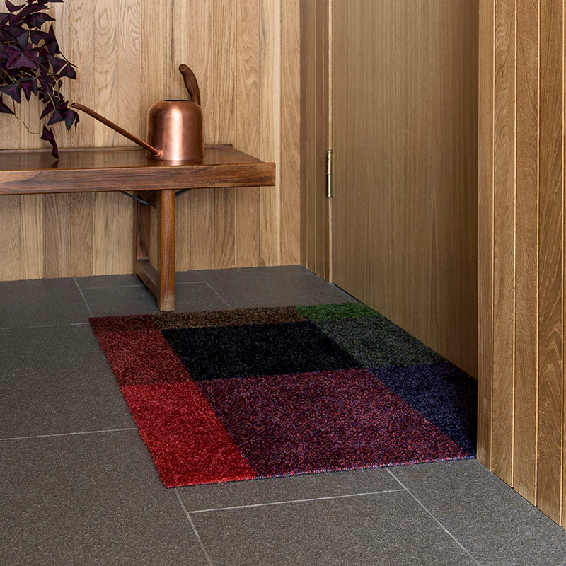 The Mix Doormat from Heymat in gem in a doorway.