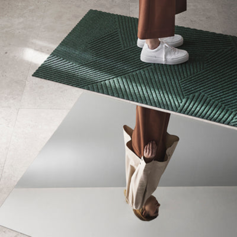 The Strå Doormat from Heymat in a living room.