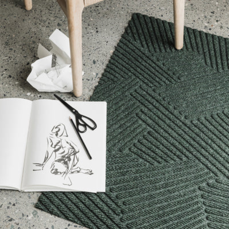 The The Strå Doormat from Heymat in a lounge.