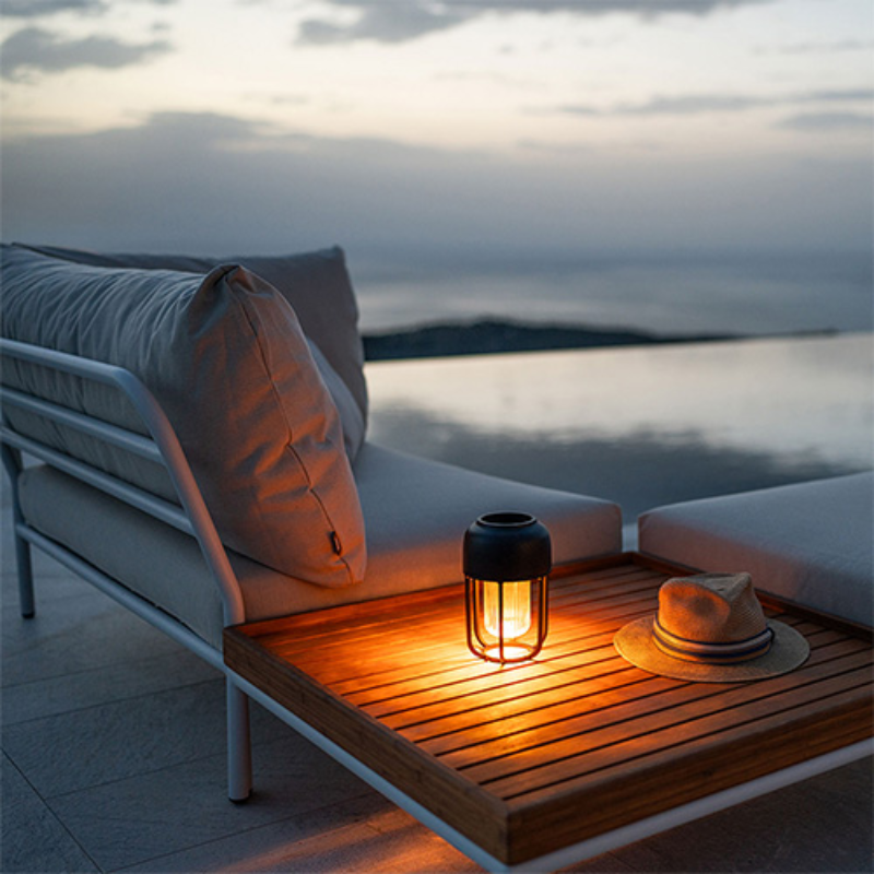 The Light No. 1 Portable Lamp from Houe in an outdoor lounge.