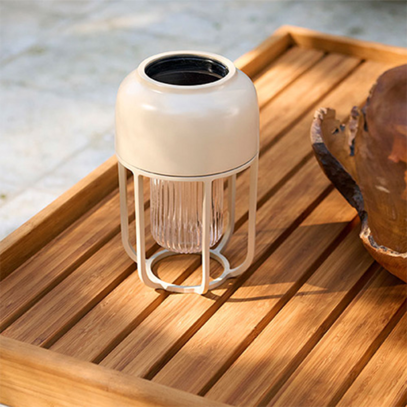 The Light No. 1 Portable Lamp by Houe is beside a pool.