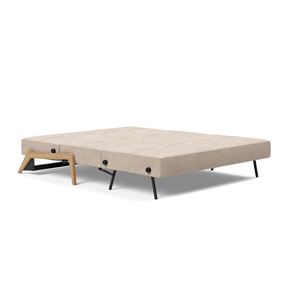 The Cubed Queen Size Sleeper Sofa with Wood Legs from Innovation Living with lacquered oak legs and adario taupe 257 upholstery setup as a bed.