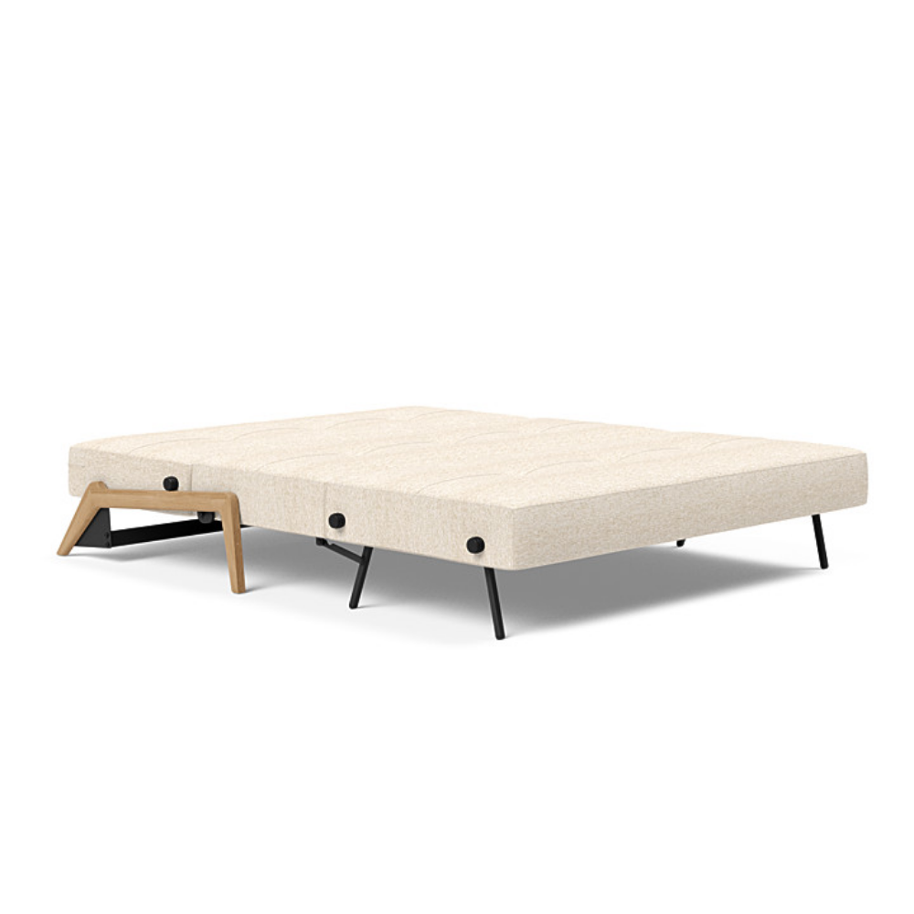 The Cubed Queen Size Sleeper Sofa with Wood Legs from Innovation Living with lacquered oak legs and halifax shell 365 upholstery setup as a bed.