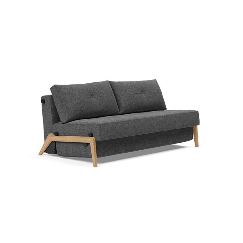 The Cubed Queen Size Sleeper Sofa with Wood Legs from Innovation Living with lacquered oak legs and taura deep grey 350 upholstery setup as a sofa.