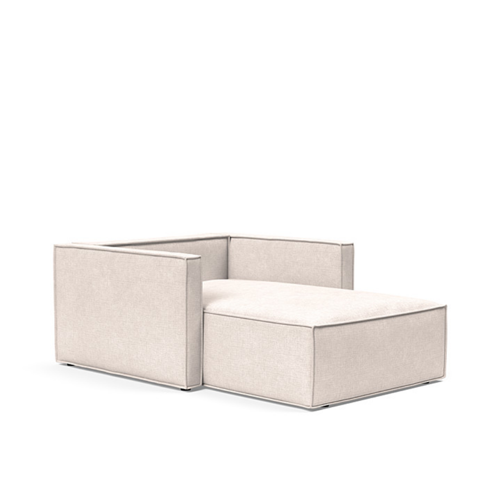 The Newilla Lounger Chair with Slim Arms with adario basmati 255 upholstery without the cushion, setup as a bed.