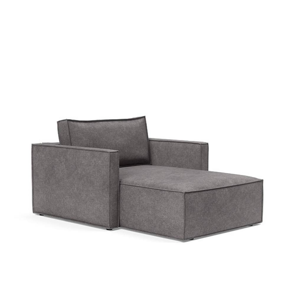 The Newilla Lounger Chair with Slim Arms with avella warm grey 282 upholstery setup as a lounge chair.
