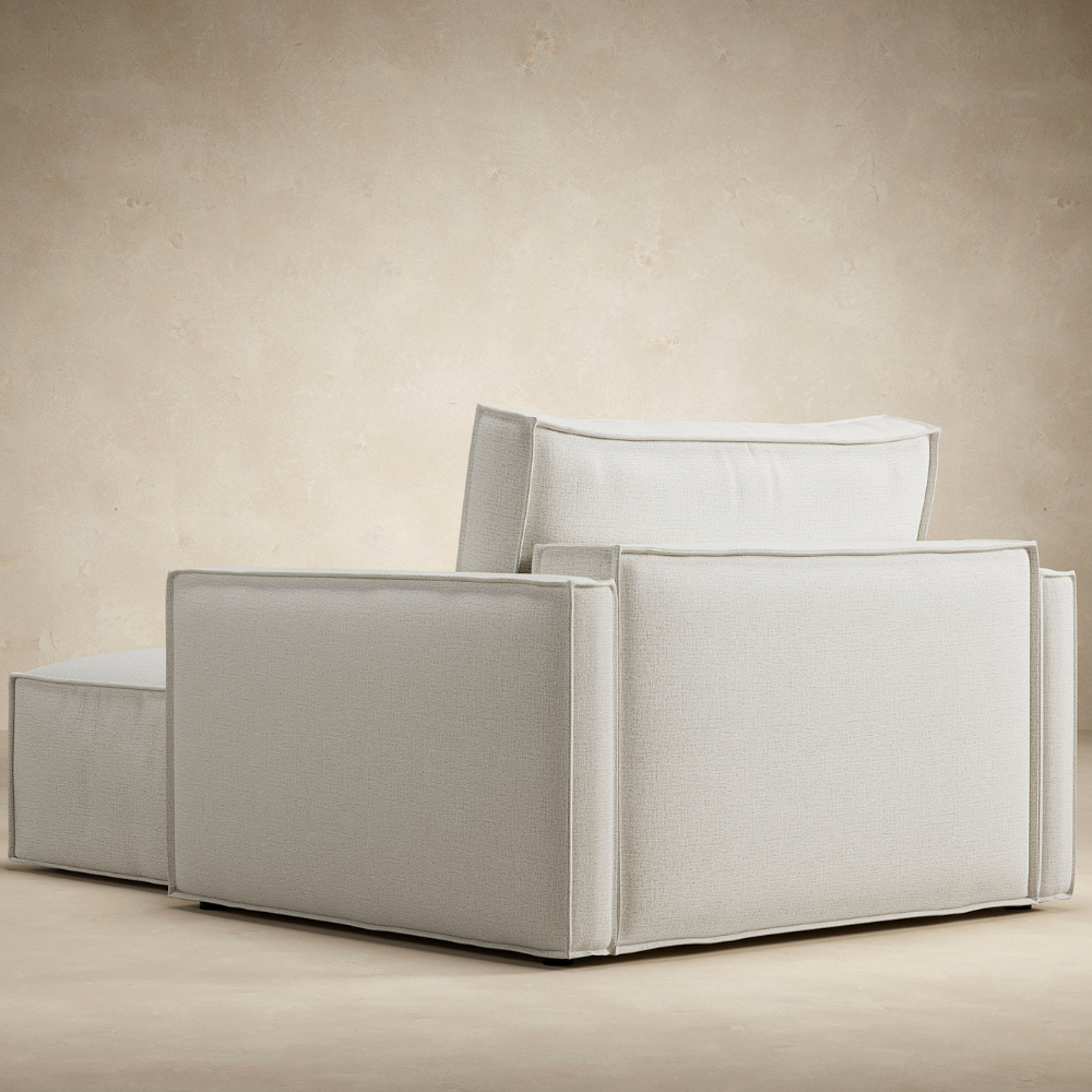 The Newilla Lounger Chair with Slim Arms from the back in a family space. all-groups