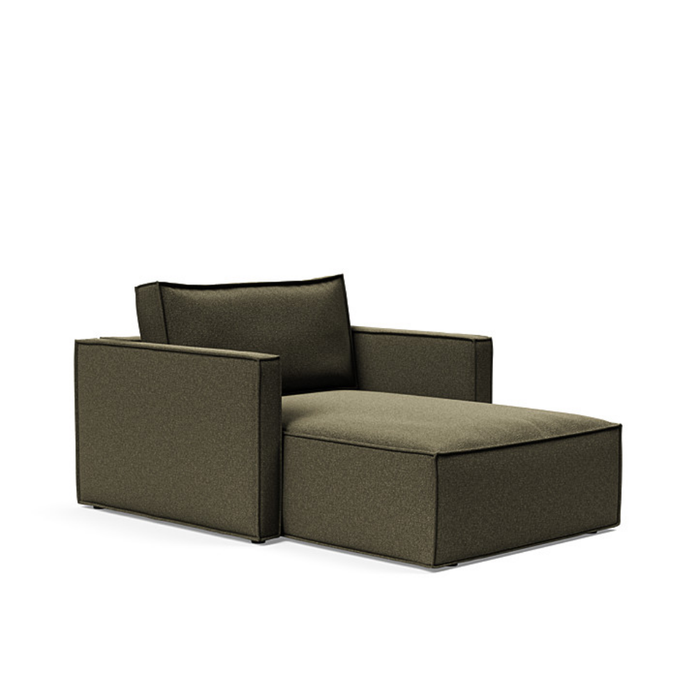 The Newilla Lounger Chair with Slim Arms with boucle forest green 535 upholstery setup as a lounge chair.