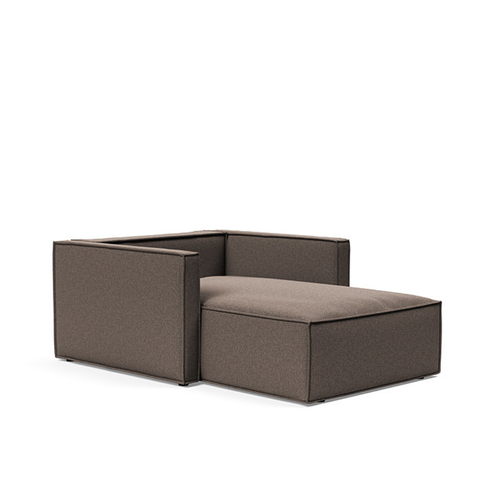 The Newilla Lounger Chair with Slim Arms with boucle taupe 530 upholstery without the cushion, setup as a bed.