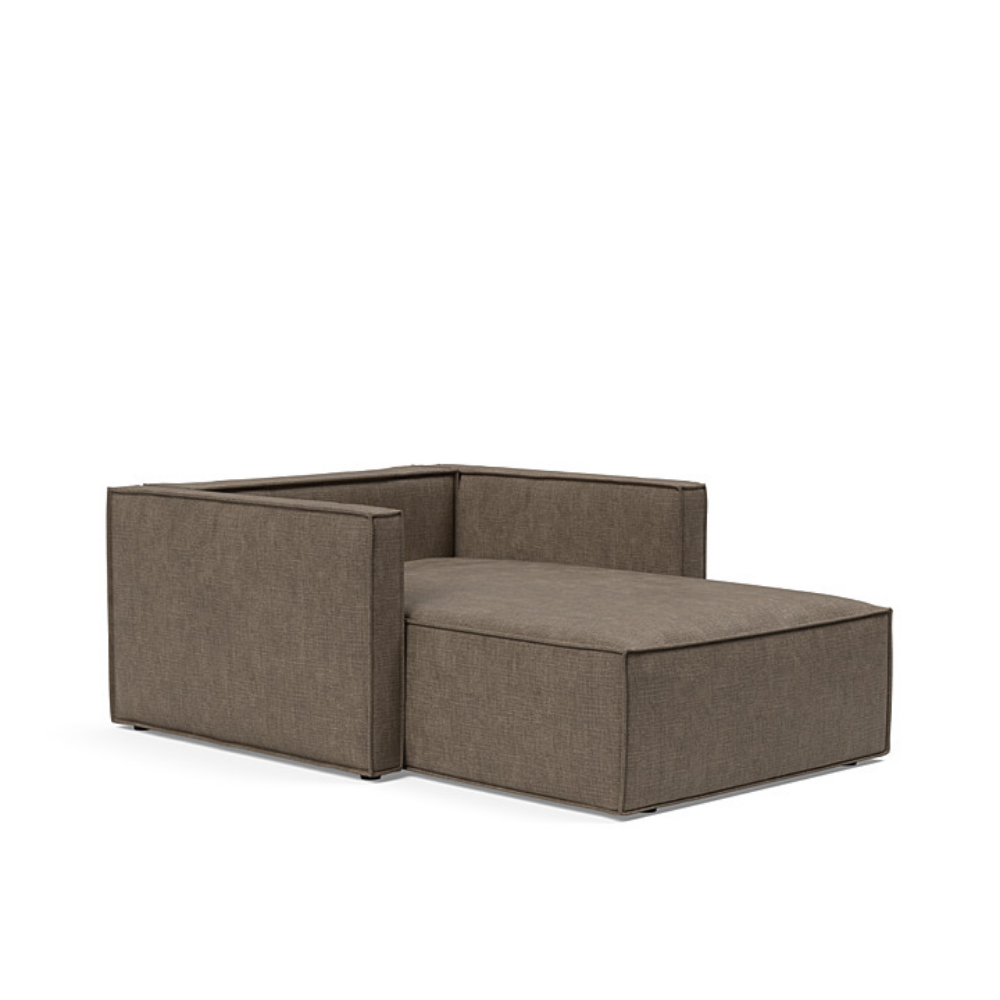 The Newilla Lounger Chair with Slim Arms with esina cedar brown 411 upholstery without the cushion, setup as a bed.